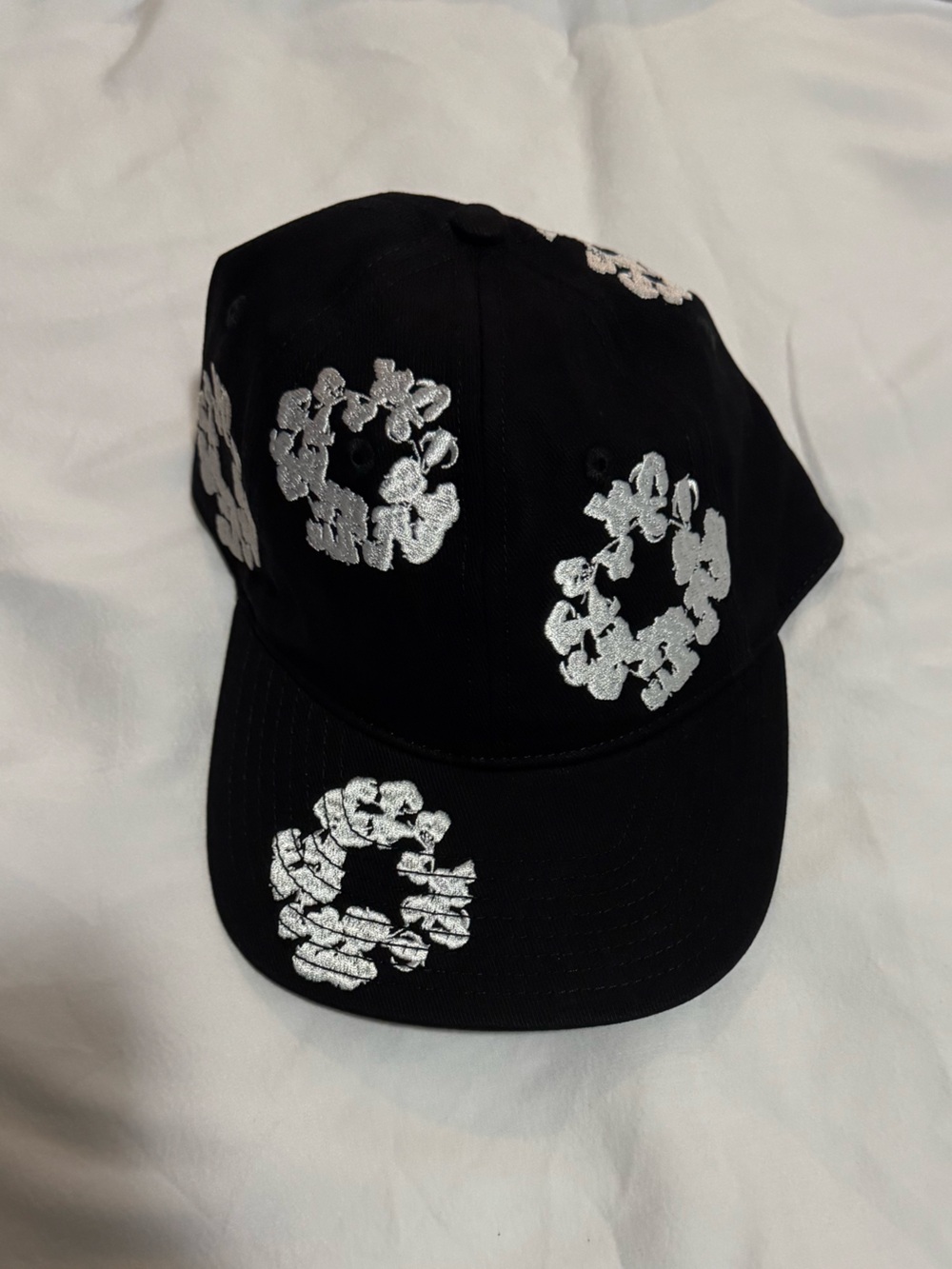 Denim Tears Black hat with trademark “Clouds” embroidery w/ black leather strap.